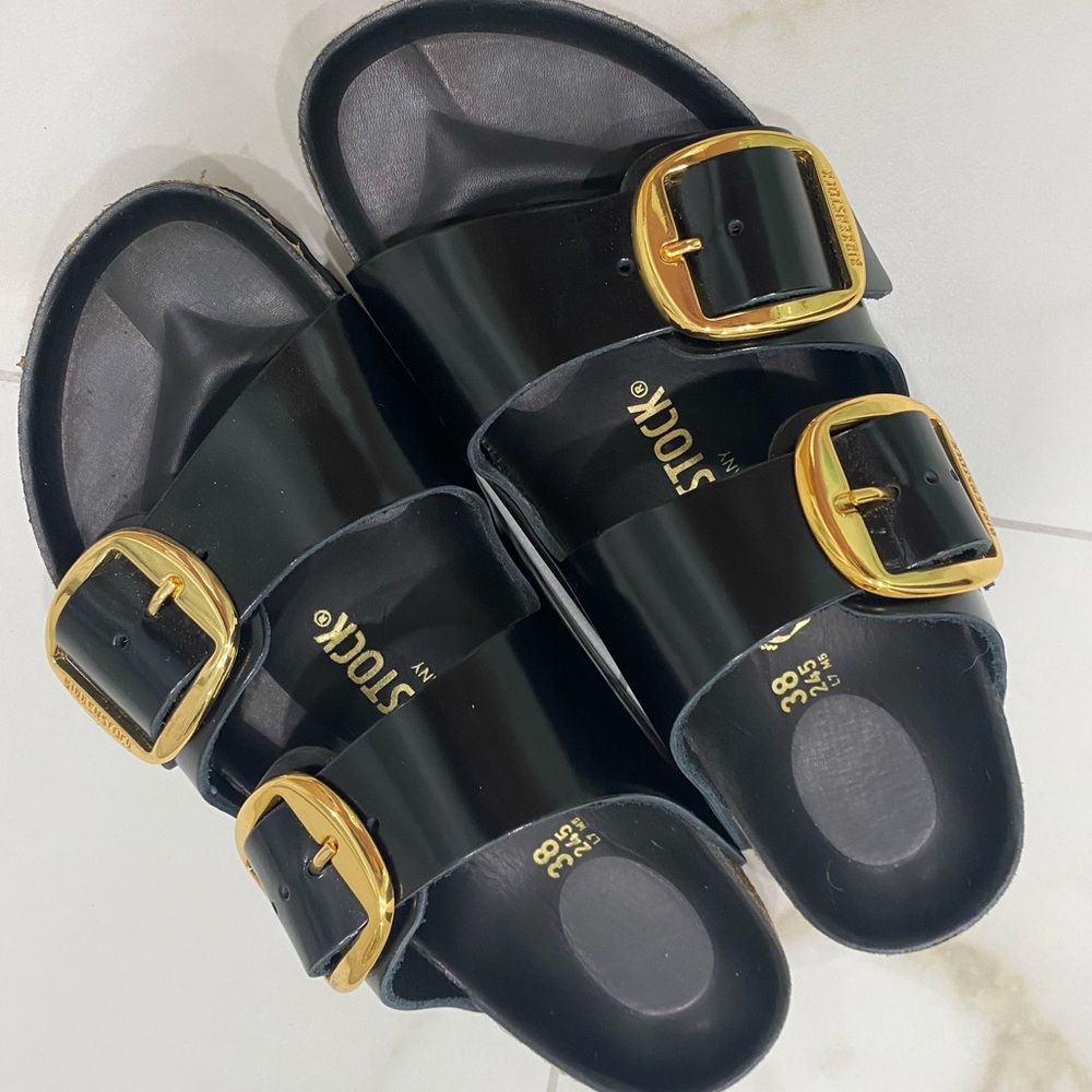 Birkenstock Glossy Black Sandals with Gold Accents